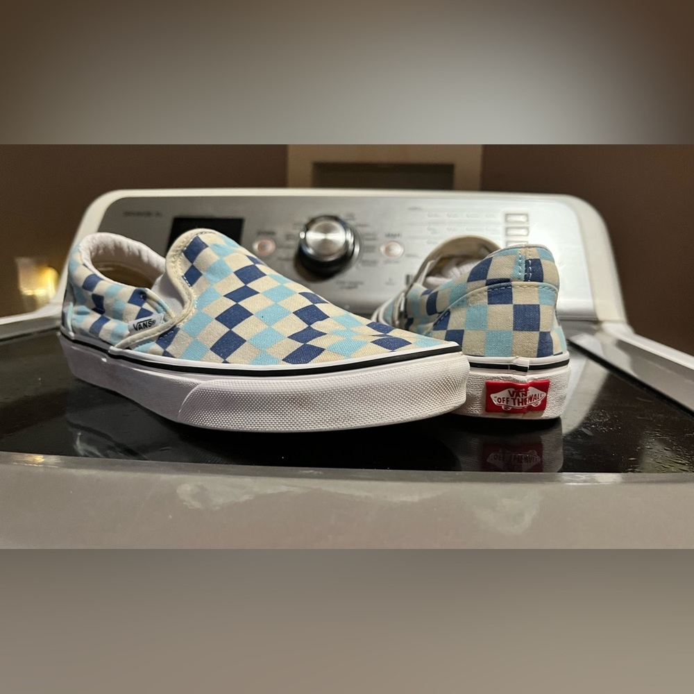 Checkered Vans slip-ons